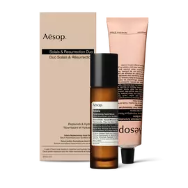 Un flacon pompe de Serum Nourrissant pour les Mains Solais et un tube de Baume Aromatique Resurrection pour les Mains reunis dans un coffret.